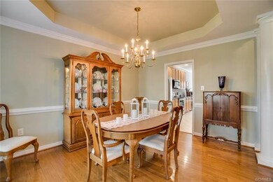 Formal dining room, just off the kitchen, with tra