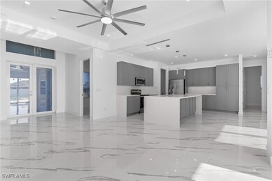 Unfurnished living room with ceiling fan, recessed