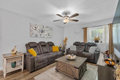 Living area featuring light wood-type flooring, a 