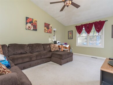Family room with vaulted ceiling that leads to dec