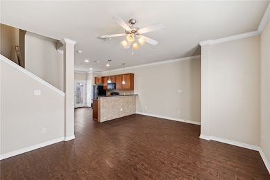 Unfurnished living room with dark wood-type floori