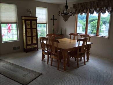 Dining Room. Light and bright!! w/ beautiful chand