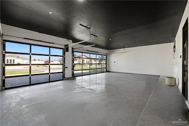 Garage featuring baseboards