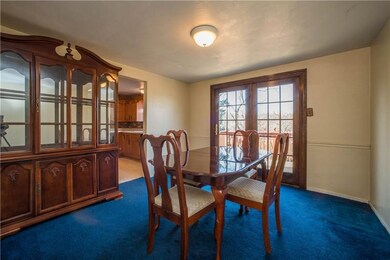 French doors in the dining room open to the upper 