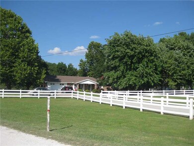 Exterior Front. Great 2 acre parcel with fencing all around, 2-car garage, and fantastic shade trees!