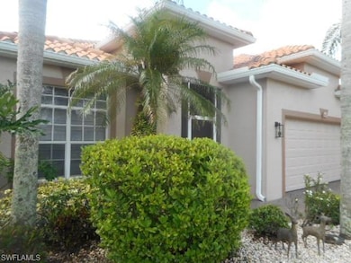 View of property exterior with stucco siding, a tiled roof, and an attached garage
