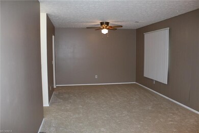 View of the living room from the front door. Dinin
