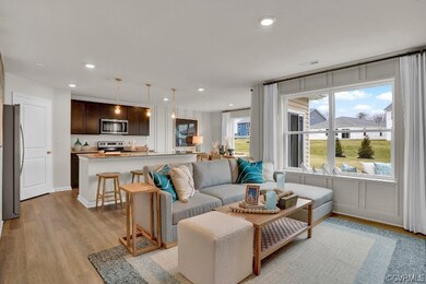Living room with light hardwood / wood-style floor