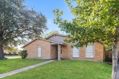 Ranch-style home with an enhanced front yard