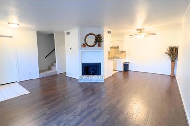 Unfurnished living room featuring a fireplace, dar
