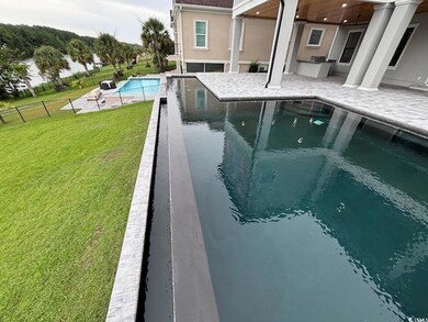 View of pool featuring a yard and a patio area