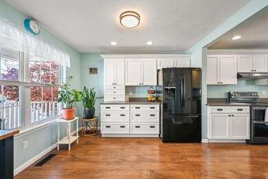 Large eat-in kitchen with black stainless steel ap