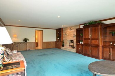 The family room is accented with crown molding and