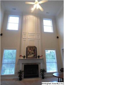 Soaring 2-story ceilings in family room give this 