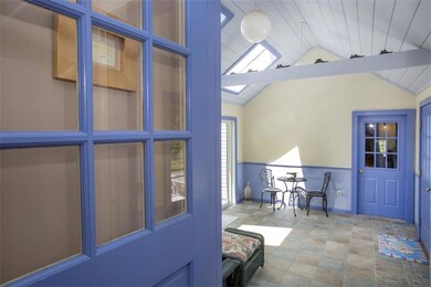A bright sun room ushers you into...