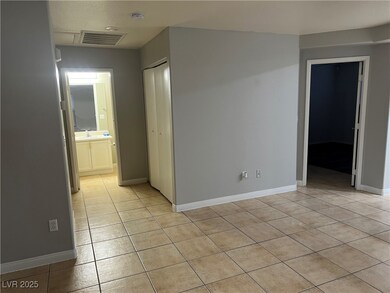 Spare room featuring light tile patterned floors,