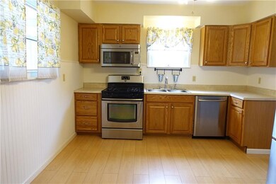 Large Kitchen with abundant cabinetry, newer floor