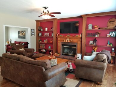 Built in book shelves and big bay window in Family