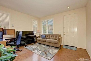 The cozy living room is bright and cheerful, with 