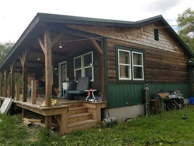 Side view of the home.  To the right is another en