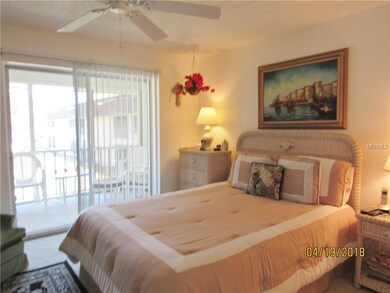 Bedroom with sliding doors to porch.