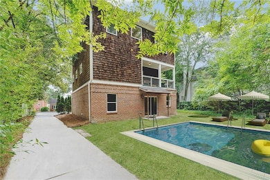 View of front of home with a garage and a front yard