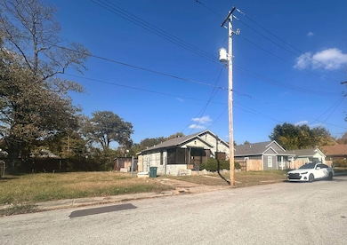 Bungalow-style home featuring a sunroom and a front lawn