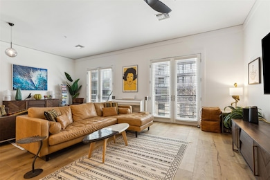 Living room with visible vents and light wood-styl
