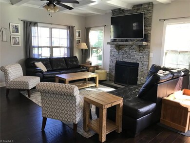 Beautiful open living space. Coffered ceilings, natural light, and 9ft ceilings.