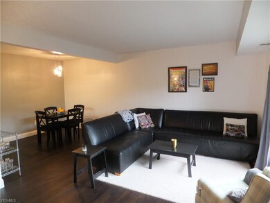 Living room/dining room combination, painted in soothing, neutral colors.