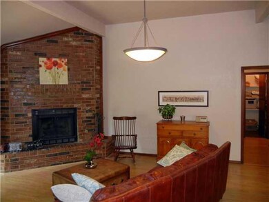 Exterior Front. The dramatic corner fireplace is a