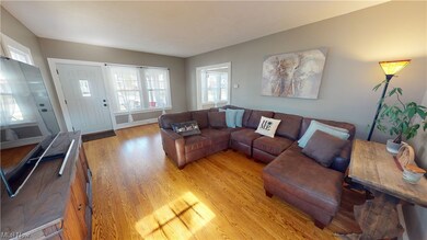 Living room with light hardwood / wood-style floors