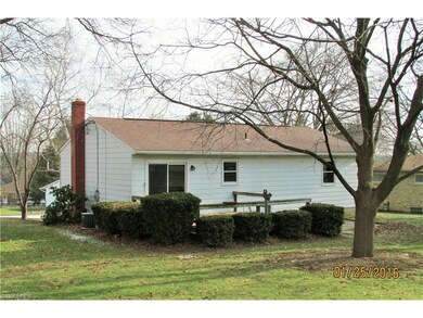 Large deck off of kitchen leads to a spacious back