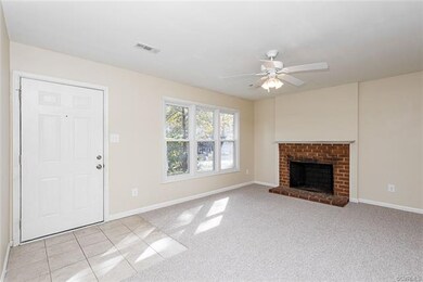 Family room. Wood burning fireplace. New carpet.