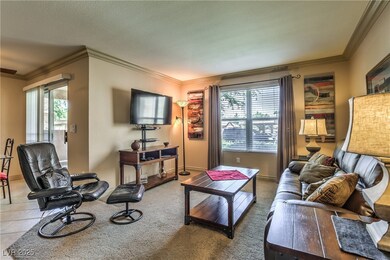 Living room featuring crown molding and a textured