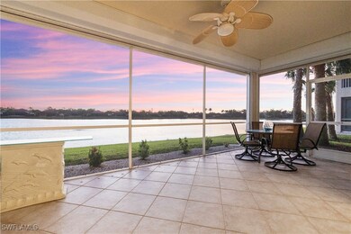 Sunroom featuring ceiling fan and a water view