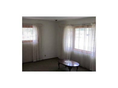 Living Room. Newer carpeting in this light room