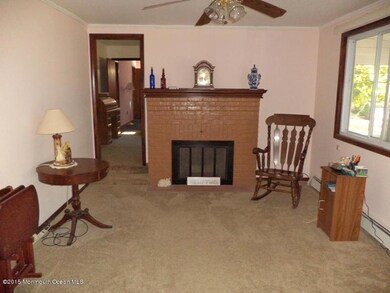 Living Room w. woodburning Fireplace