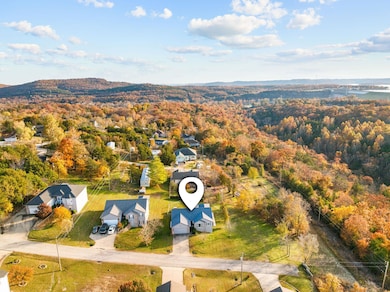 Last Home on the left.