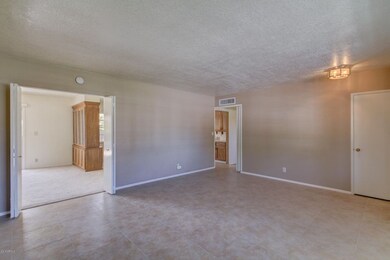 LIVING ROOM TO HALL AND FAMILY ROOM