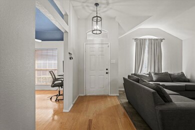 Foyer with light hardwood / wood-style flooring an