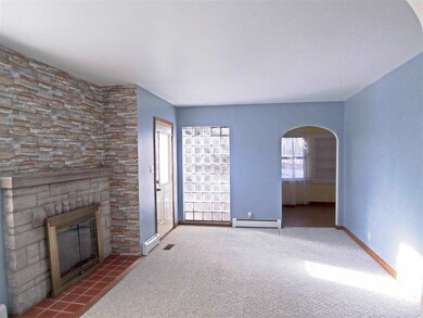 An abundance of natural lighting and arched doorwa