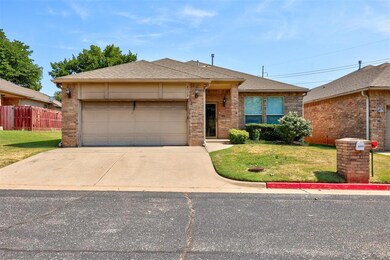 Ranch-style house with a front lawn and a garage
