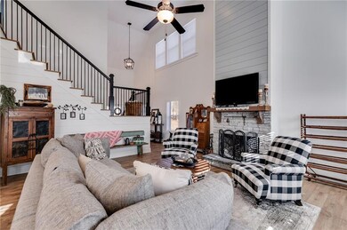 Living room with hardwood / wood-style flooring, a