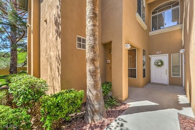 Property entrance amidst manicured grounds.