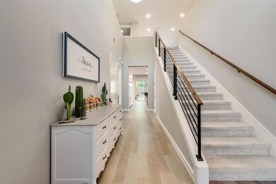 As you enter the home, guest room and bath to the 