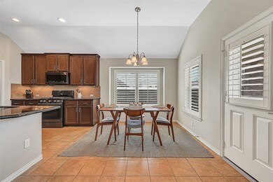 Extensive breakfast area off the kitchen with lots of natural light and great views of the backyard.