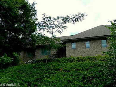 Exterior Front. house sits atop hill