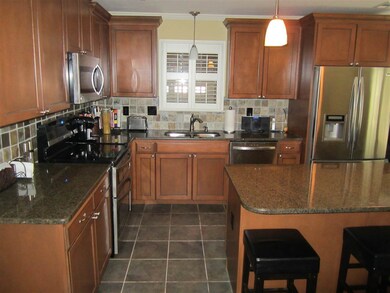 Stainless Steel, new cabinets, Granite and Tile