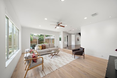 The living area has sliding doors to the back yard